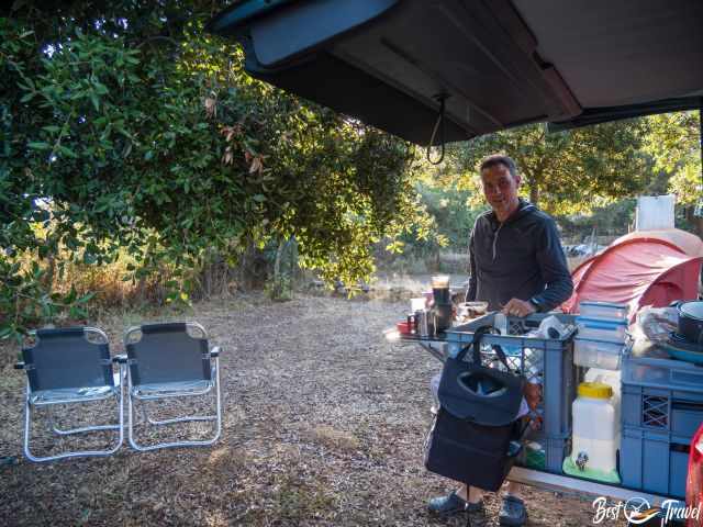 Our opened van and Markus at the spacious campsite