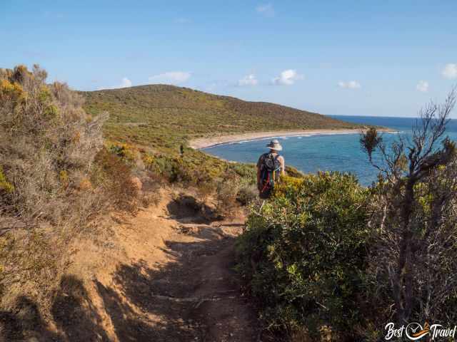 A hiker on the coastal trail Sentier des Douaniers