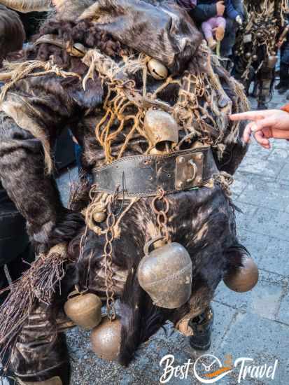 A costume made of goat skin with plenty of bells and jingles