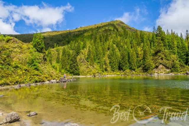 Hikers on the trail at the bottom of Fogo Lake