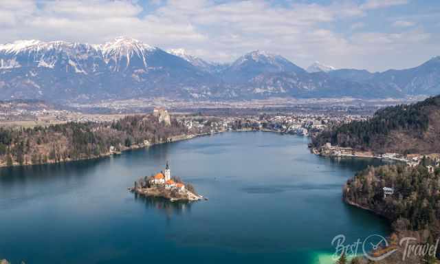 Lake Bled with snow capped mountains in the back.