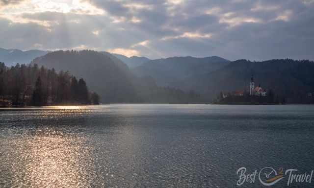 Magical atmosphere with clouds and light at lake bled and island