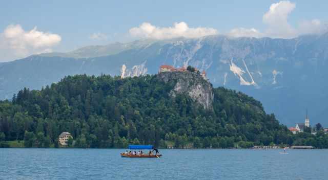 Bled Castle and rowing boat on Lake Bled