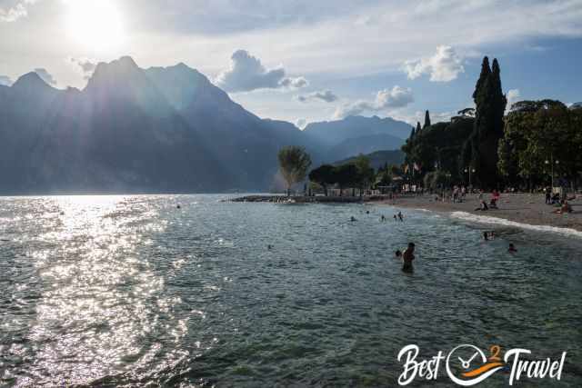 People swimming and taking a bath in the lake