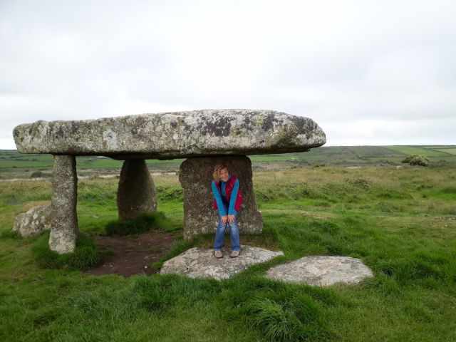 A visitor at the famous burden of Lanyon Quoit.