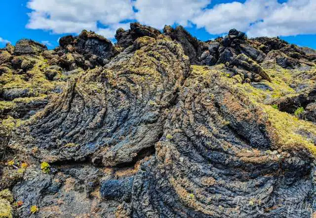 The pattern of the lava and dotted with lichen