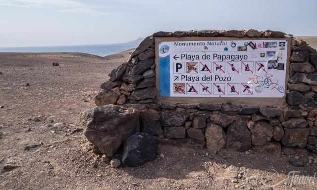 Beach sign at a rock leading to Pozo and Papagayo