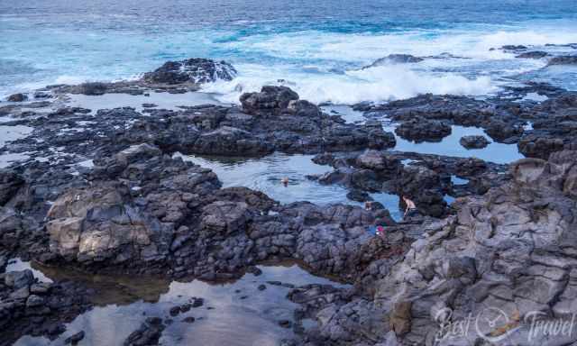 A group bathing in the Los Charcones Natural Pools