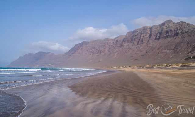 The long Famara Beach and Cliffs