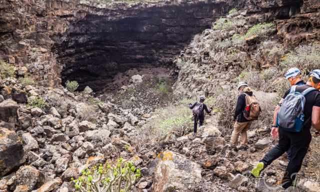 A group access a long lava tube