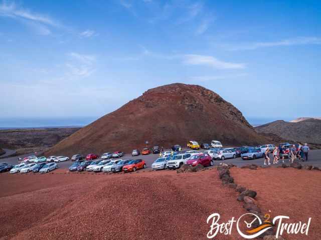 The parking lot in Timanfaya National Park and visitors going to the demostration.
