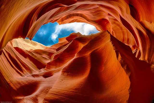 The view to the blue sky and white clouds  from the Antelope in red and orange