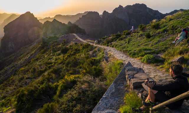 Watching the sunset from Pico Arieiro with the spectacular mountain scenery.