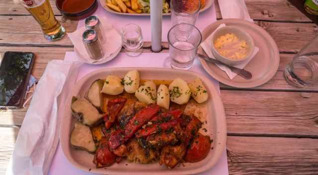 Bacalhau or cod fish with red peppers, sweet potatoes, and potatoes