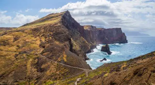 The breathtaking high cliffs and volcanic rocks.