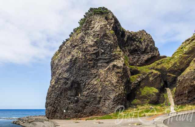 A staircase is leading to and through the volcanic rock