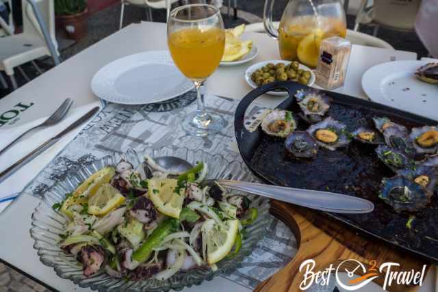 A table full of seafood and sangria.