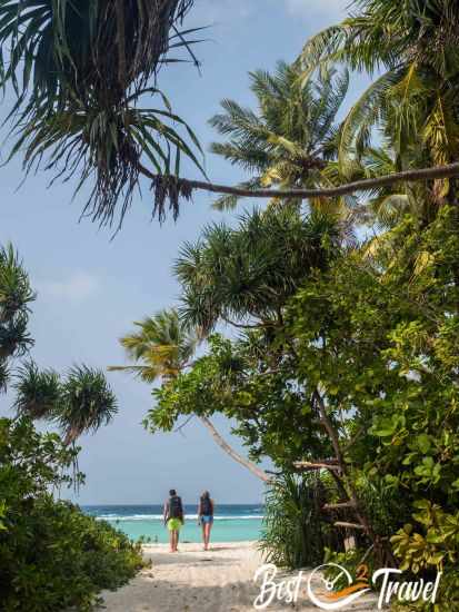 Two backpackers accessing the beach