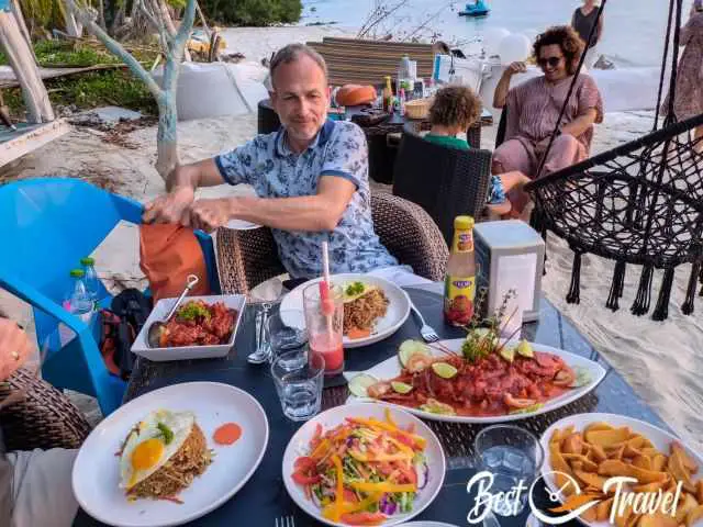 A table full of seafood dishes at the sea.
