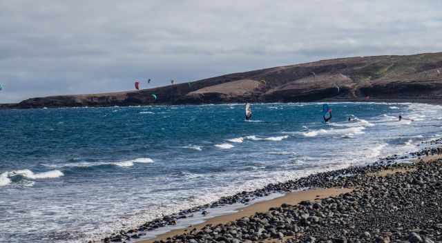 Kite Surfer on a cloudy day in a bay 