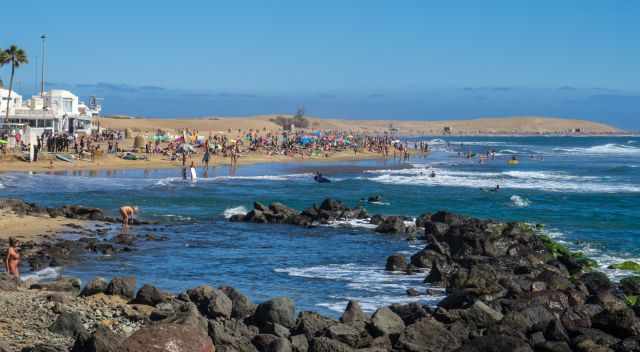 Crowded Maspalomas Beach in the high season