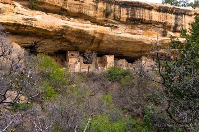 A zoom photo of a cliff dwelling from the opposite side
