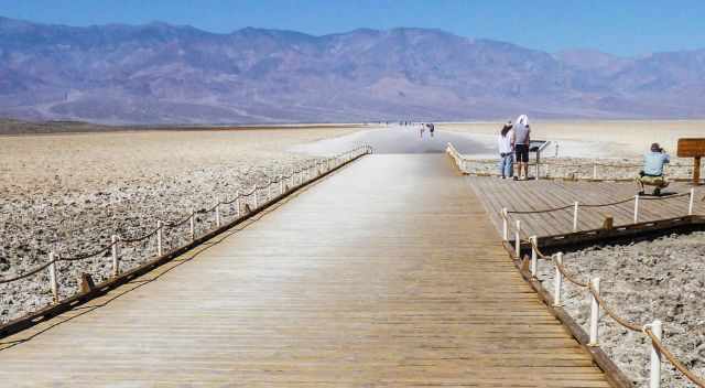 Boardwalk with people in the desert