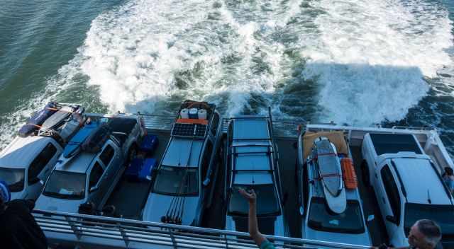 The back of the ferry full of off-road vehicles