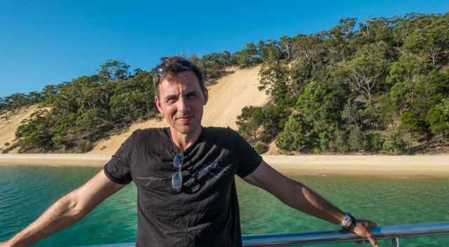 A Moreton visitor on the ferry with one of the dunes in the back