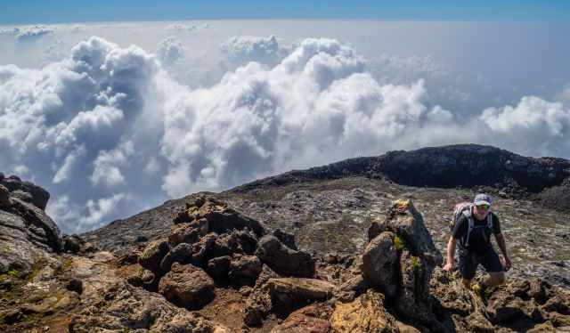 A hiker almost at the lava cone of Pico