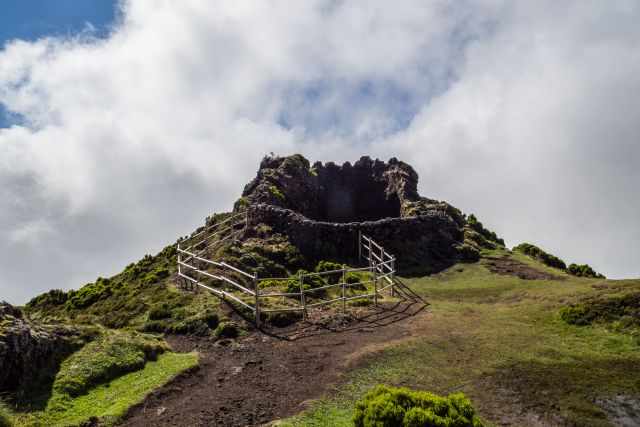 The cave which is not accessible and a fence for visitors protection.