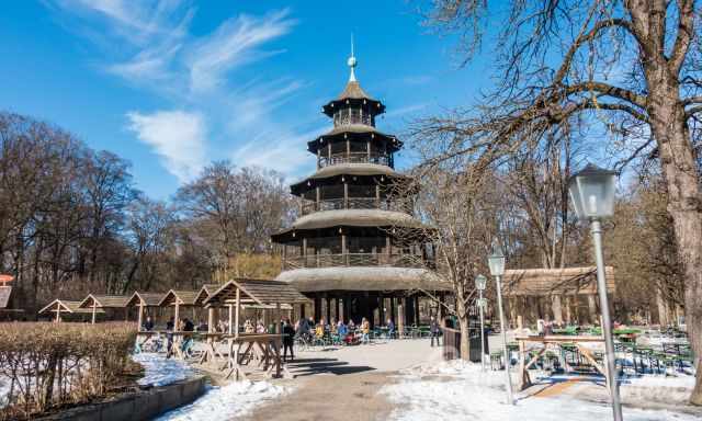 The Chinese tower and the beer garden in winter with snow.