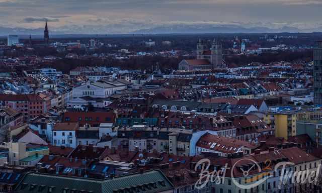 The rooftops of Munich and the mountains on the horizon