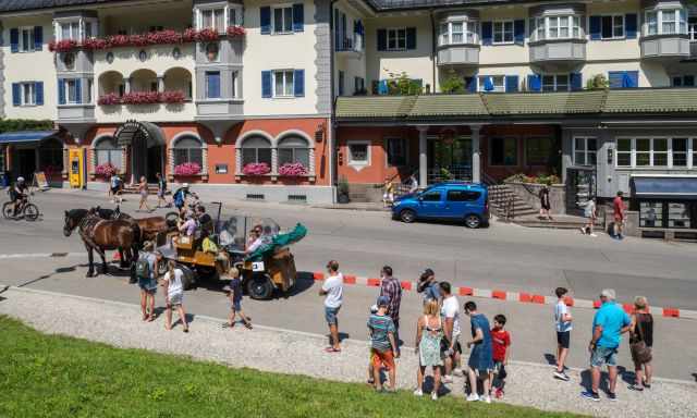 People in Schwangau waiting for a horse carriage ride