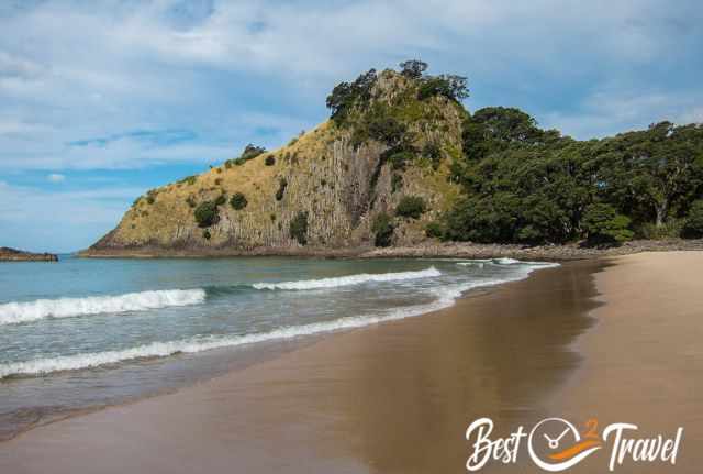The rugged, exposed rock frames New Chums Beach and provides the best view.
