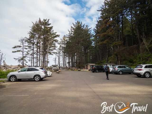 A hiker walking from the parking lot to the trailhead of Rialto