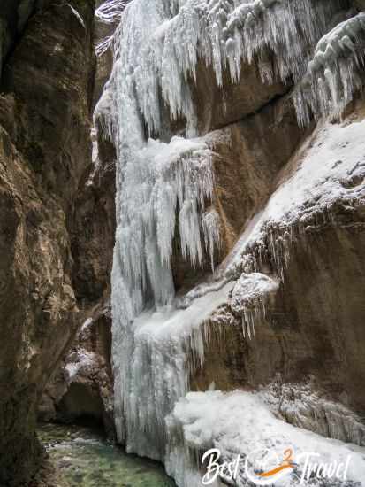 Immense big and many icicles are at the gorge walls