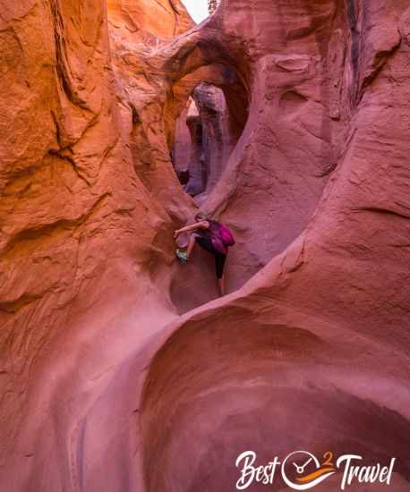 A woman climbs up the key section in Peek-A-Boo
