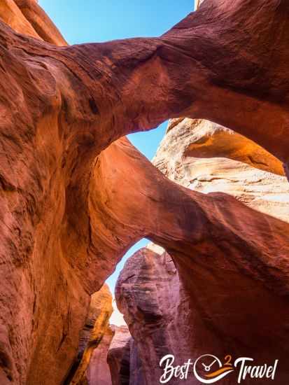 View up to the sky and arch formations in Peek-A-Boo