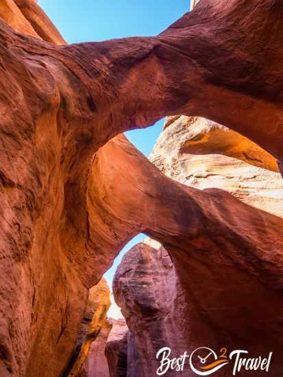 View up to the sky and arch formations in Peek-A-Boo