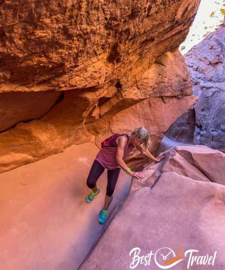 A woman climbing above a rockslide