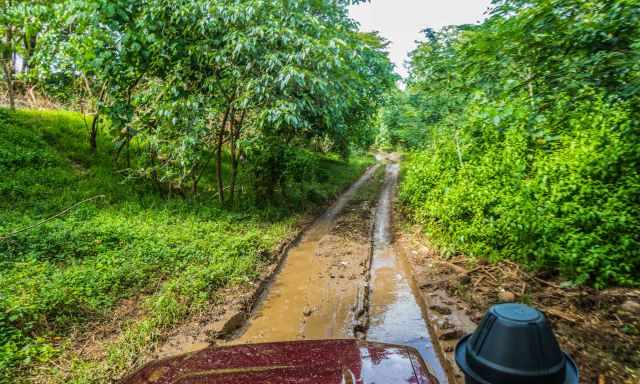 The jeep had to pass a flooded muddy road