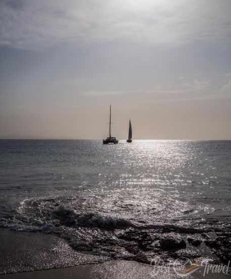 Catamaran and sailboat on the sea