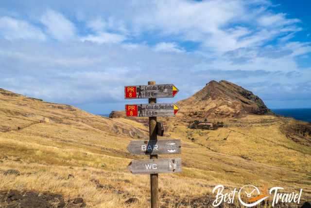 Several hiking signs and the tip of Sao Lourenco
