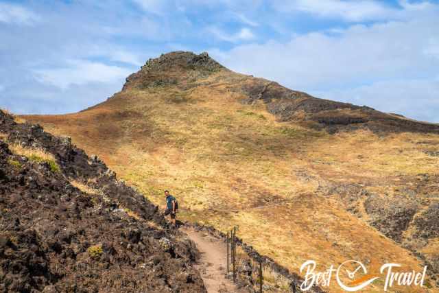 A hiker at an exposed section of this track.