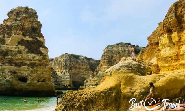 An arch with a boy on it at low tide