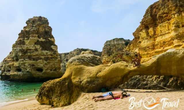 A rock arch at Praia da Marinha during low tide