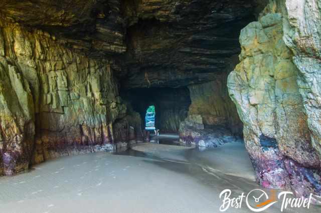 The colourful rocks in red and yellow inside the Remarkable Cave.