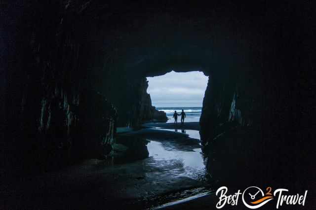 A couple returning from the hidden beach appearing as shadow