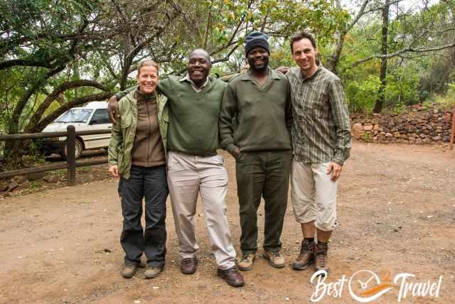 Two armed rangers and Markus and I in front of the jeep